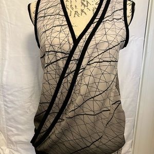 Calvin Klein sleeveless black and white graphic blouse with silver buckle. XS